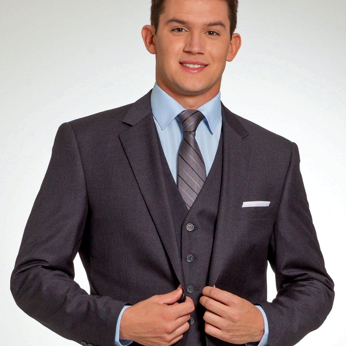 gentleman in a dark charcoal purchase suit