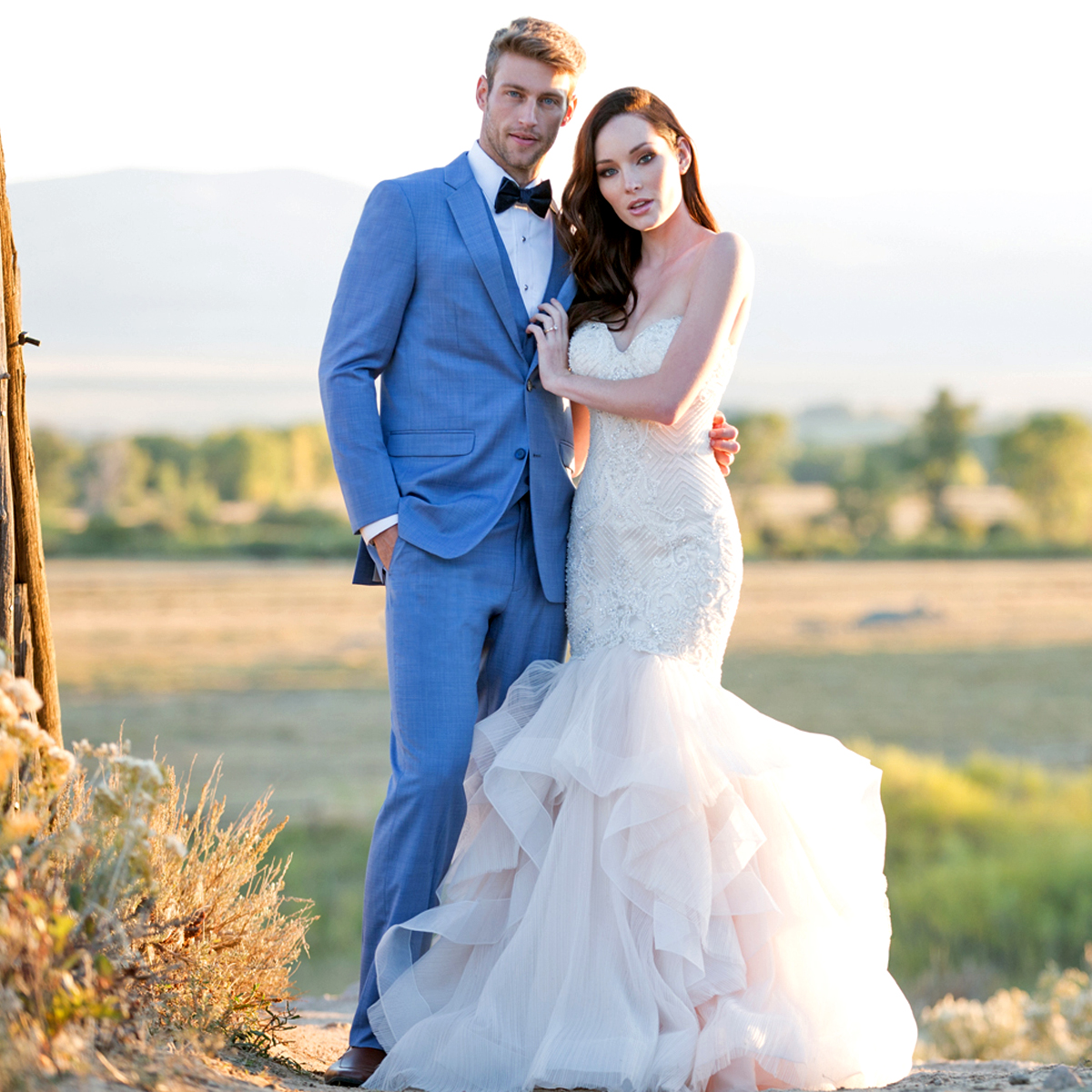 groom and bride models posing in cornflower blue tuxedo