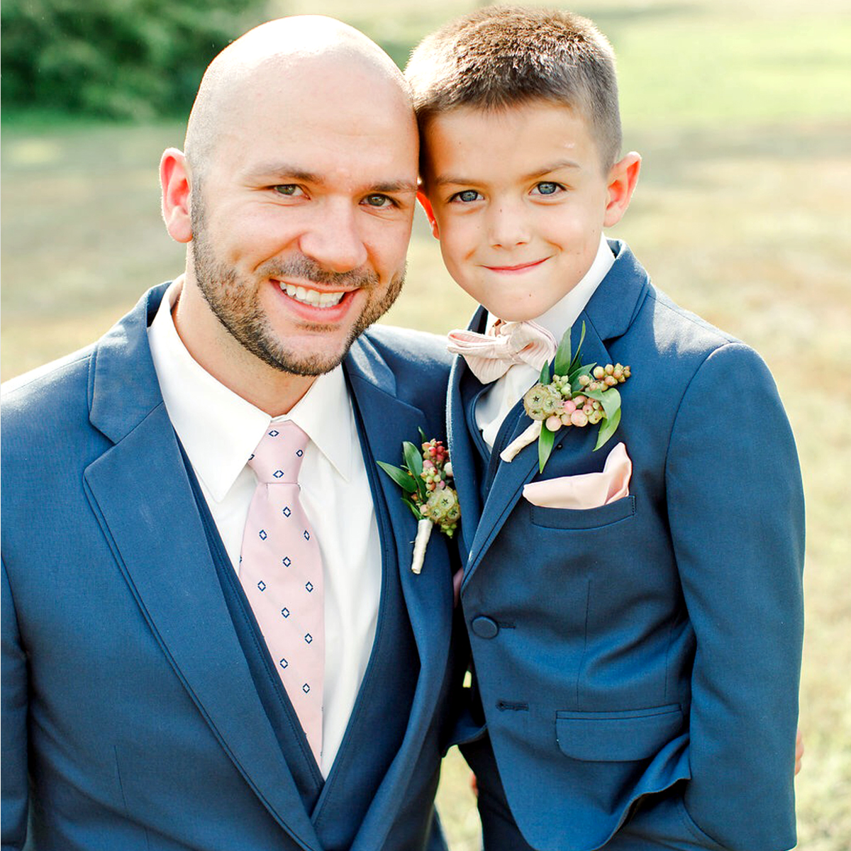 boy and father on wedding day in matching tuxedos